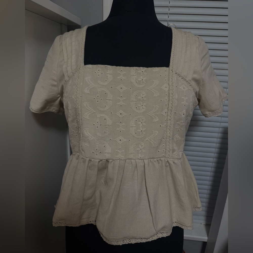 Woman’s cream blouse